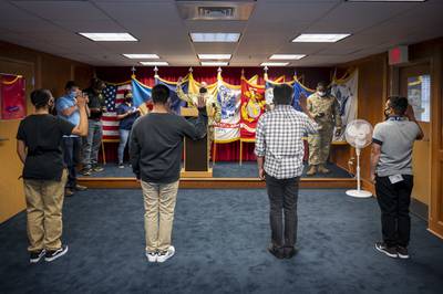 Future sailors, soldiers and airmen take the oath of enlistment at the Military Entrance Processing Station Fort Dix on June 13, 2020, in Lakehurst, N.J.