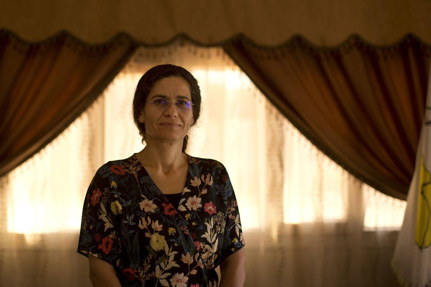 In this Sept. 3, 2019, photo, Ilham Ahmed, co-chair of the executive committee of the U.S-backed Syrian Democratic Council, speaks during an interview in Darbasiyah, Syria.