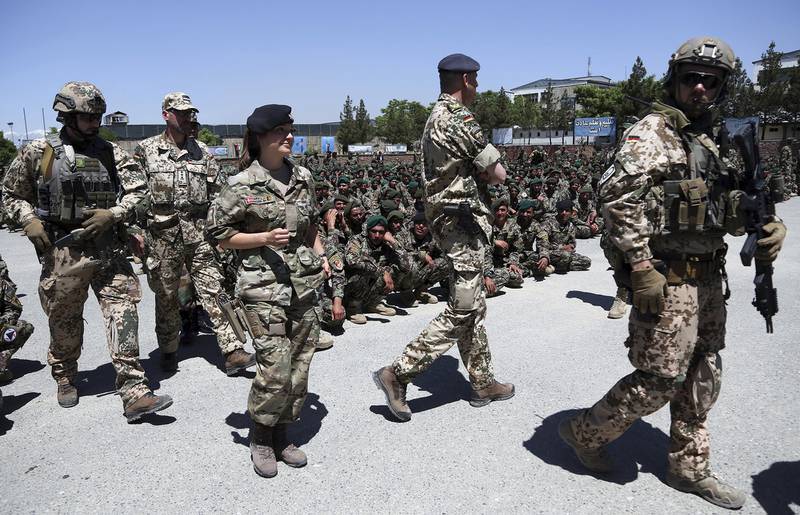 NATO forces attend the graduation ceremony of Afghan National Army soldiers