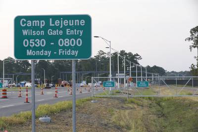 In this July 31, 2014, file photo, traffic moves onto Camp Lejeune in Jacksonville, N.C., as access to via the now open Wilson Gate goes into effect