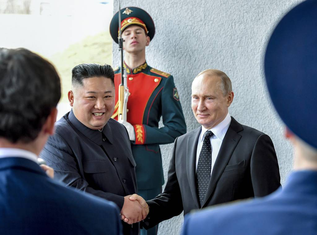 Russian President Vladimir Putin, center right, and North Korea's leader Kim Jong Un shake hands during their meeting in Vladivostok, Russia, Thursday, April 25, 2019.