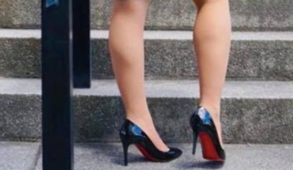 Female service member pairs $700 heels with dress blues, causing