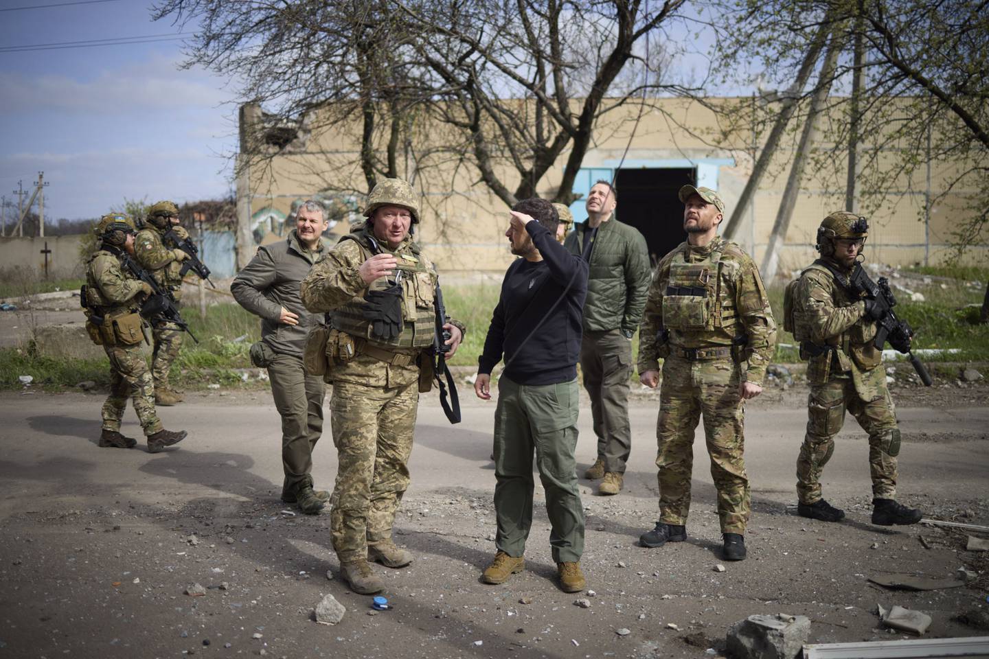 In this photo provided by the Ukrainian Presidential Press Office, Ukrainian president Volodymyr Zelenskyy talks with a commander at a position in Avdiivka, Donetsk region, Ukraine, Tuesday, April 18, 2023.