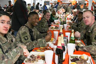 Soldiers at Bagram Airfield in Afghanistan enjoy Thanksgiving dinner in 2018. While this year’s Thanksgiving meal may look different, the Defense Logistics Agency Troop Support has been providing traditional Thanksgiving food to field kitchens, dining facilities and galleys to locations in the United States and around the world. (Photo: Army Staff Sgt. Caitlyn Byrne)