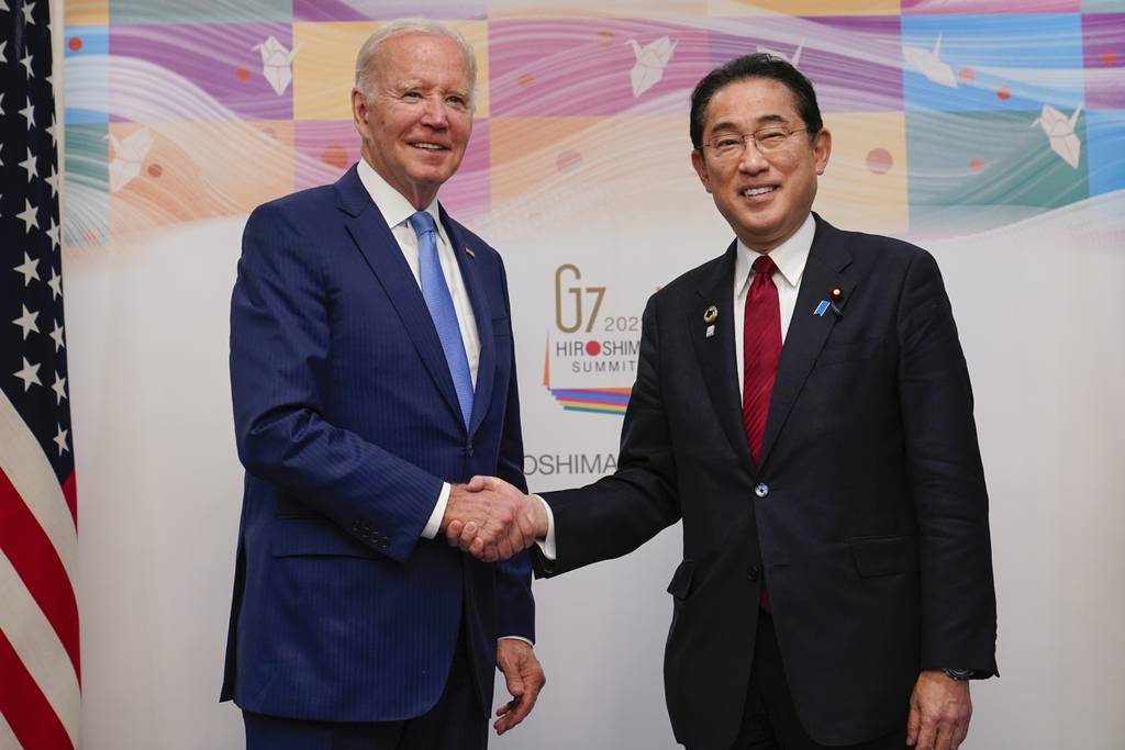 President Joe Biden, left, shakes hands with Japan's Prime Minister Fumio Kishida ahead of a bilateral meeting in Hiroshima, Japan, Thursday, May 18, 2023, ahead of the start of the G-7 Summit.