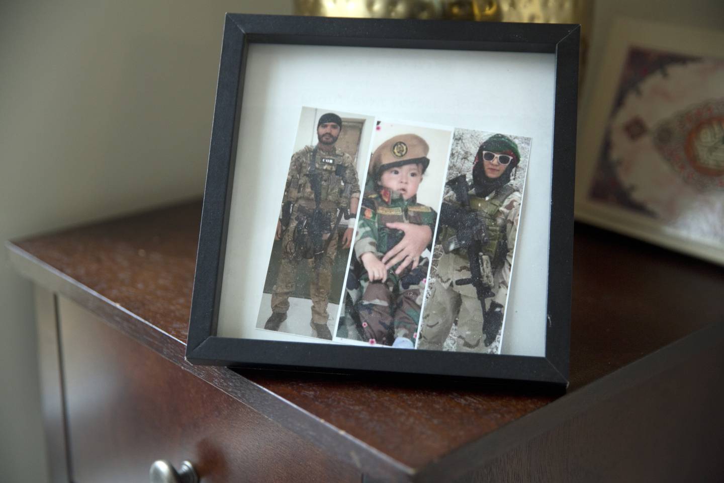 A frame in Sima Gul's living room, shows a collage of images.