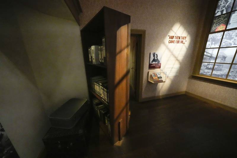 A bookcase revealing a secret hiding place is part of a replica of the home in Amsterdam where Anne Frank hid, in the new pavilion opening at the National World War II Museum in New Orleans, Tuesday, Oct. 31, 2023.