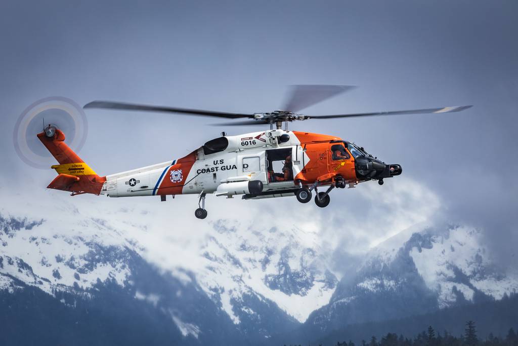 A U.S. Coast Guard Air Station Sitka helicopter hovers over Sitka Sound during routine hoist training, Alaska, Apr. 25, 2023.