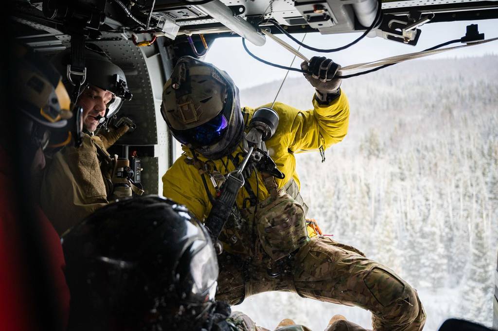 Airmen assigned to the 210th and 212th Rescue Squadrons participate in a rescue exercise near Eielson Air Force Base, Alaska, March 26, 2021. The 212th RQS provides elite pararescuemen, combat rescue officers and Survival, Evasion, Resistance, and Escape specialists to carry out the 176th Wing's wartime and peacetime rescue missions. (Airman 1st Class Jose Miguel T. Tamondong/Air Force)