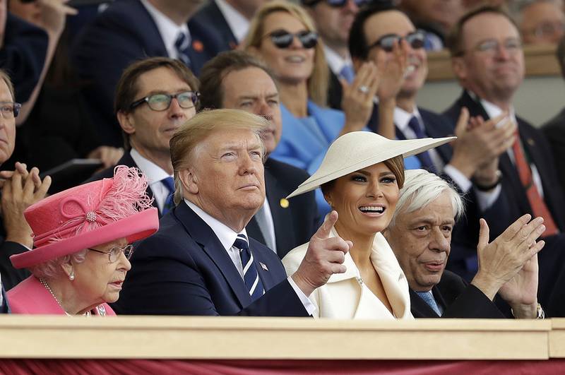 Queen Elizabeth II, President Donald Trump, first lady Melania Trump and Greek President Prokopis Pavlopoulos, from left, applaud as they watch a fly past at the end of an event to mark the 75th anniversary of D-Day in Portsmouth, England