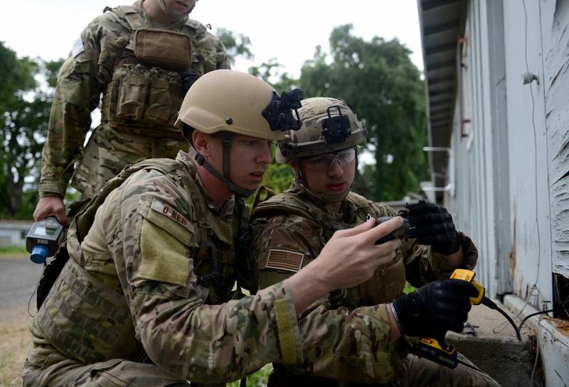 Staff Sgt. David Dezwaan (left), and Airman 1st Class Alex Nona, 60th Civil Engineer Squadron explosive ordnance disposal technicians, conduct radioactive detection methods during an exercise May 5, 2016, at Clear Lake, California. The EOD technicians participated in Operation: Half-Life, an exercise designed to evaluate a synchronized, multi-agency response to a crisis situation. (Senior Airman Bobby Cummings/Air Force)