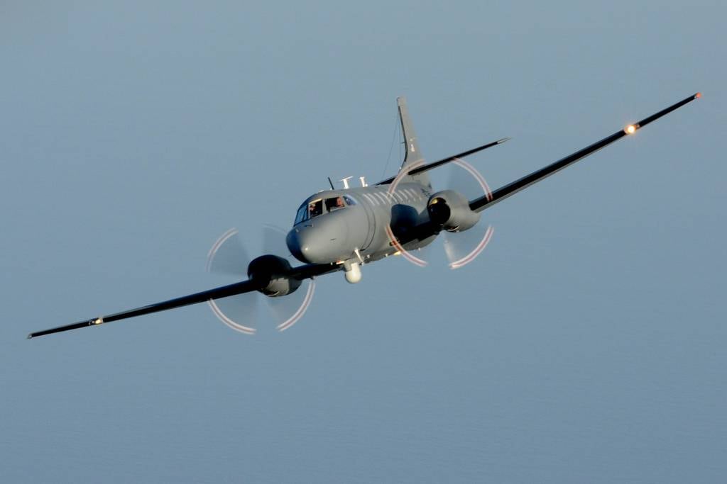An RC-26B aircraft from the Florida Air National Guard flies a training mission off the coast of Jacksonville, Fla., in 2011.
