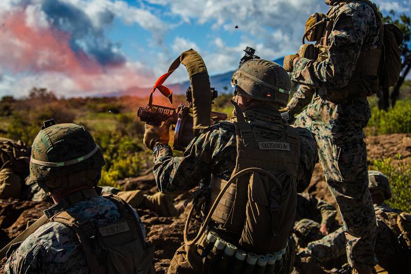 A Marine fires a 203 grenade launcher during exercise Bougainville II at Pohakuloa Training Area, Hawaii, July 19, 2020.