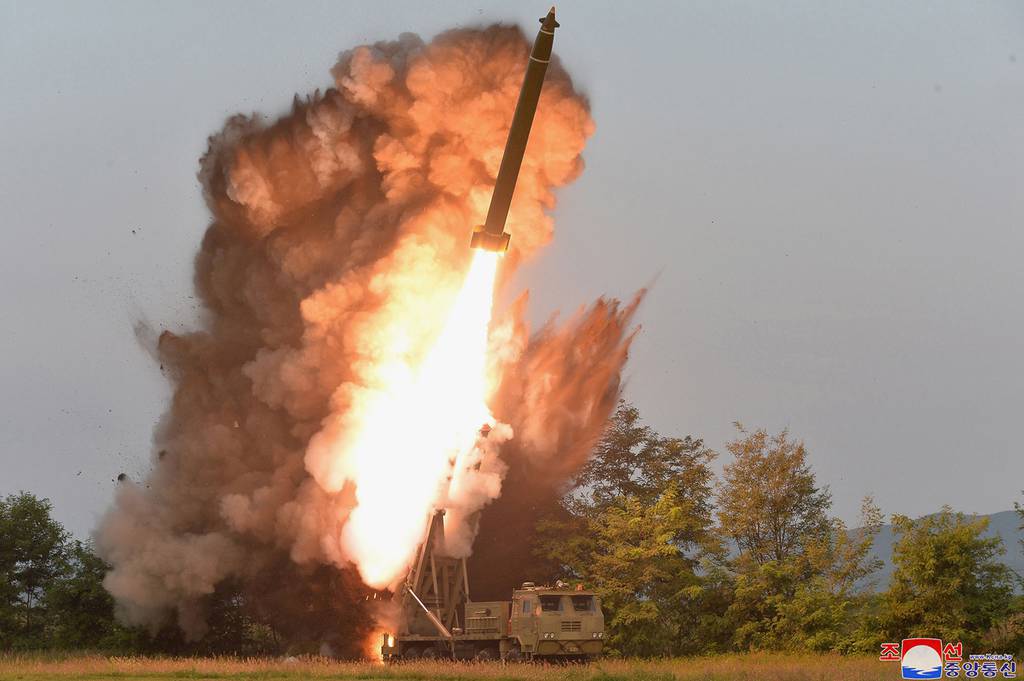 A test-firing from a multiple rocket launcher at an undisclosed location in North Korea is seen in this Sept. 10, 2019, photo.