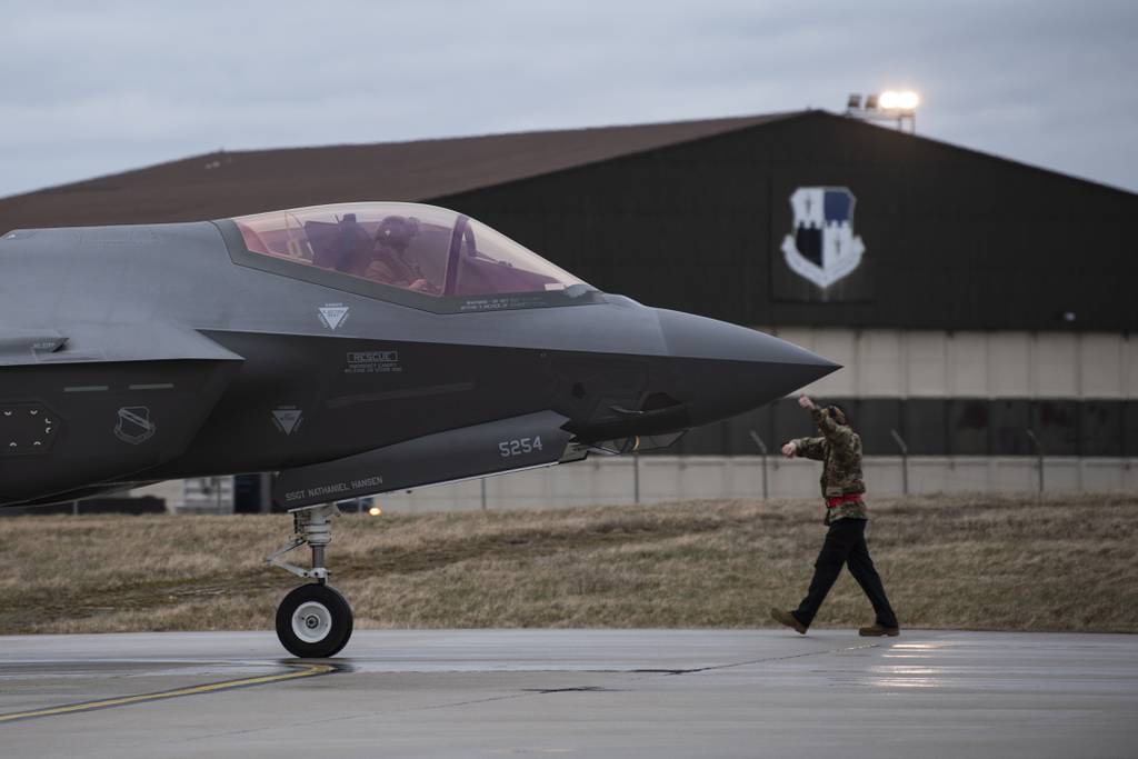 A U.S. Air Force aircraft maintainer signals to a U.S. Air Force F-35A Lightning II pilot from the 34th Fighter Squadron at Hill Air Force Base, Utah, after arriving at Spangdahlem Air Base, Germany, Feb. 16, 2022. The F-35 team deployed to Spangdahlem Air Base to increase NATO’s collective defense posture and enhance the capabilities of regional partners and allies. (Tech. Sgt. Maeson L. Elleman/Air Force)