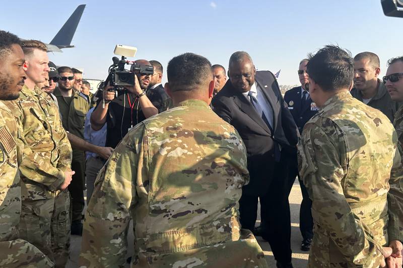U.S. Defense Secretary Lloyd Austin thanks crew members at the Nevatim Air Base in the desert in Israel, Friday, Oct. 13, 2023.