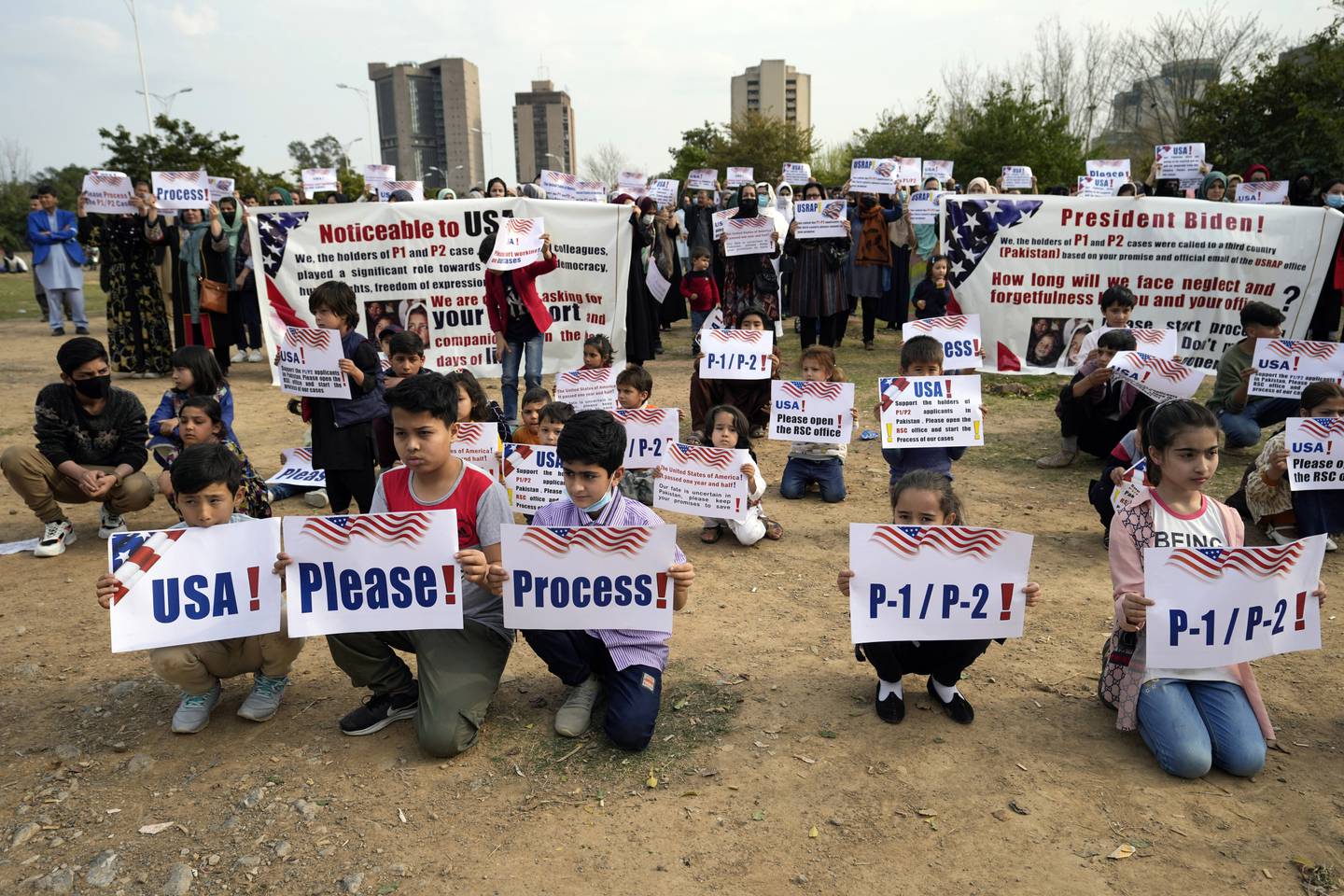 Afghan refugees hold a rally to demand their U.S. visas to be processed in Islamabad, Pakistan, Sunday, Feb. 26, 2023.