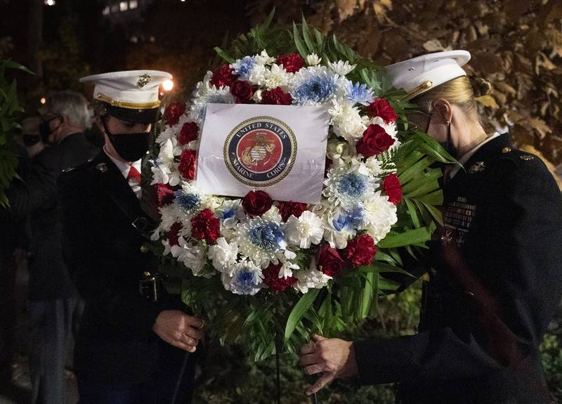 A Navy and Marine Corps honor guard lays a wreath at the Eternal Light Flagstaff in Madison Square Park, Wednesday, Nov. 11, 2020, in New York.