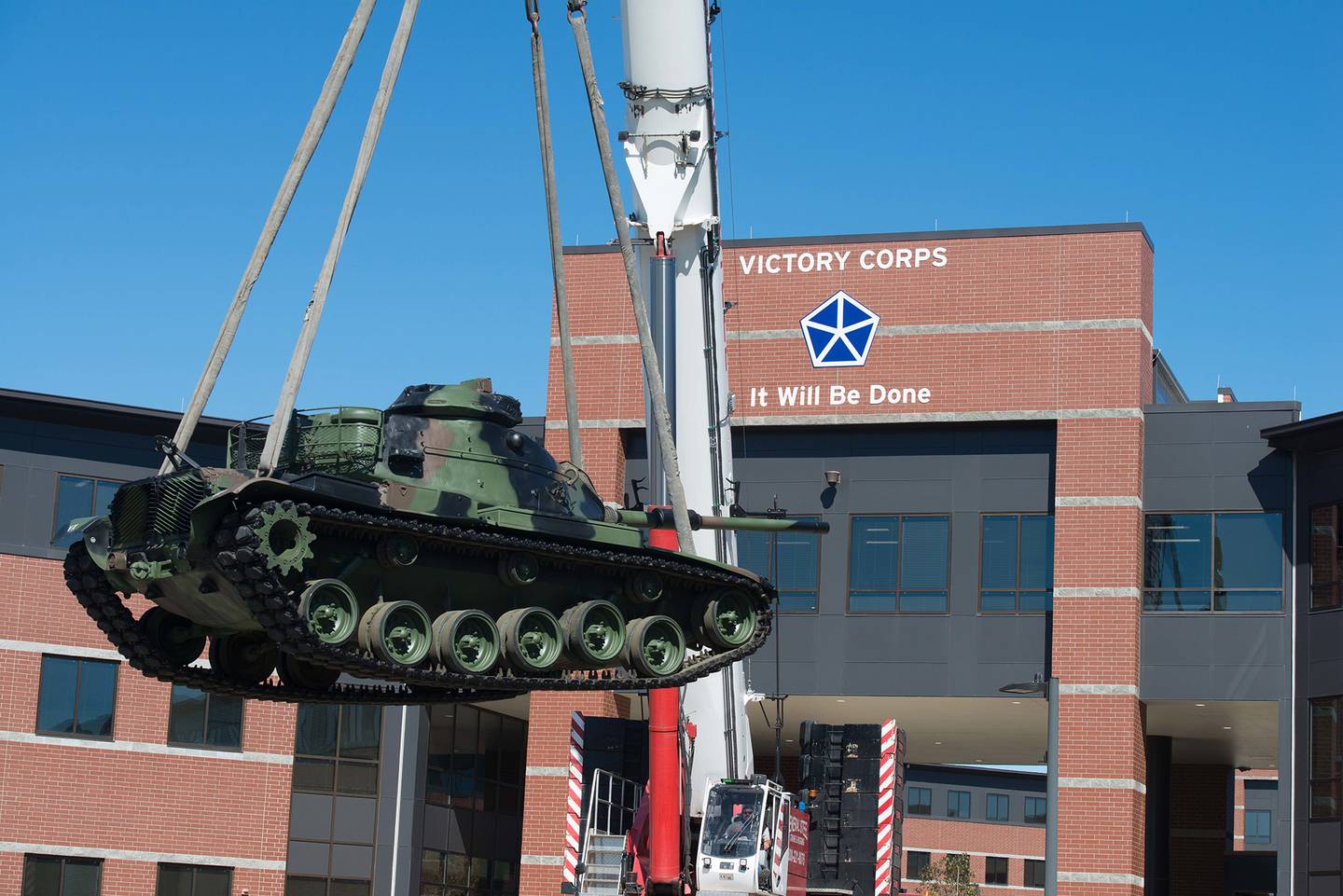 A tanks is lowered to its new home in front of the V Corps headquarters at Fort Knox, Ky., Oct. 14, 2020.