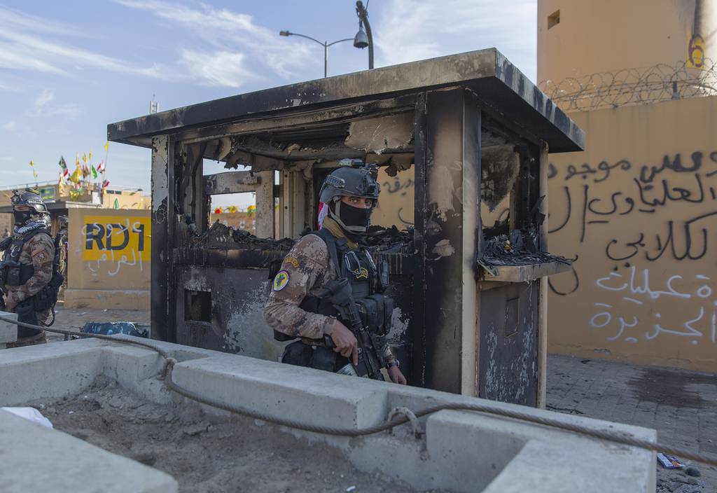 In this Jan. 1, 2020, file photo, Iraqi army soldiers are deployed in front of the U.S. Embassy, in Baghdad, Iraq.