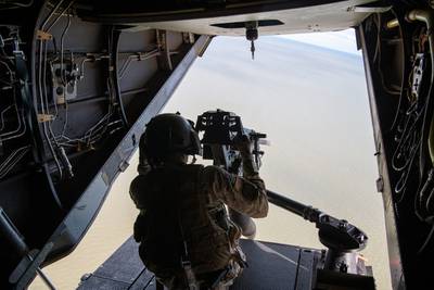 A U.S. Air Force flight engineer assigned to the 7th Special Operations Squadron readies to fire the rear-mounted .50 caliber machine gun on a CV-22B Osprey at a local range, Oct. 20, 2021. (Staff Sgt. Brandon Nelson/Air Force)