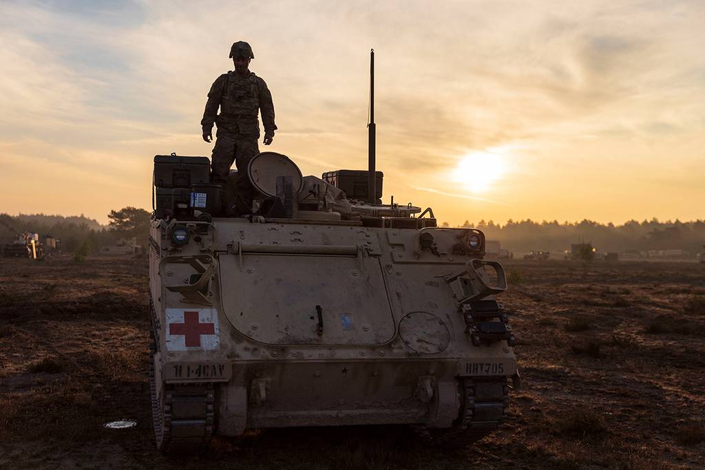 A soldier prepares an M113 armored personnel carrier for a convoy during a rapid-deployment exercise at Johanna Range, Poland,