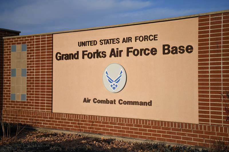 An installation sign is displayed at the main gate of Grand Forks Air Force Base, North Dakota Oct. 31, 2019.
