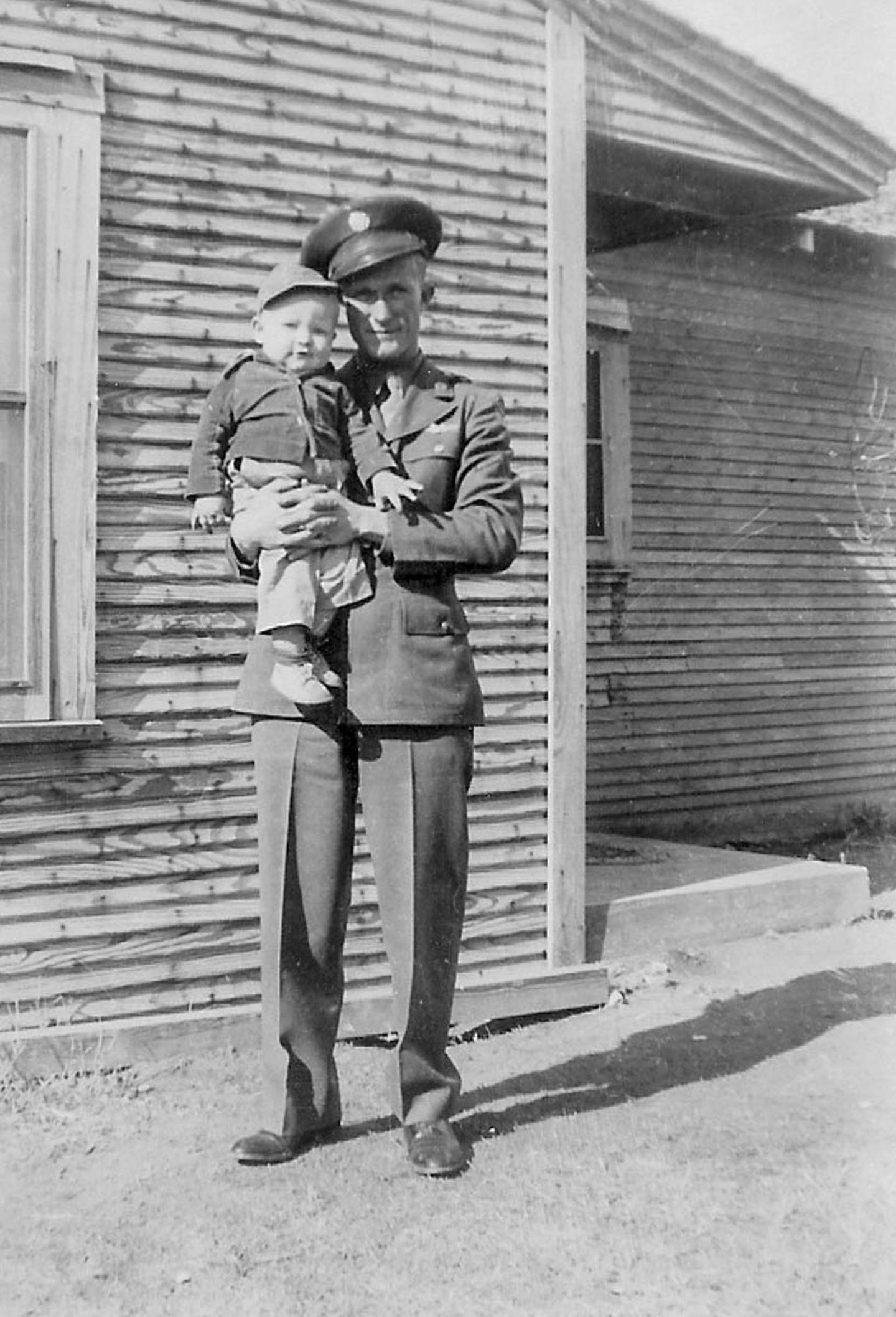 SSgt. Jimmie Doyle, nose-gunner on B-24 Heaven Can Wait, with son, Tommy.