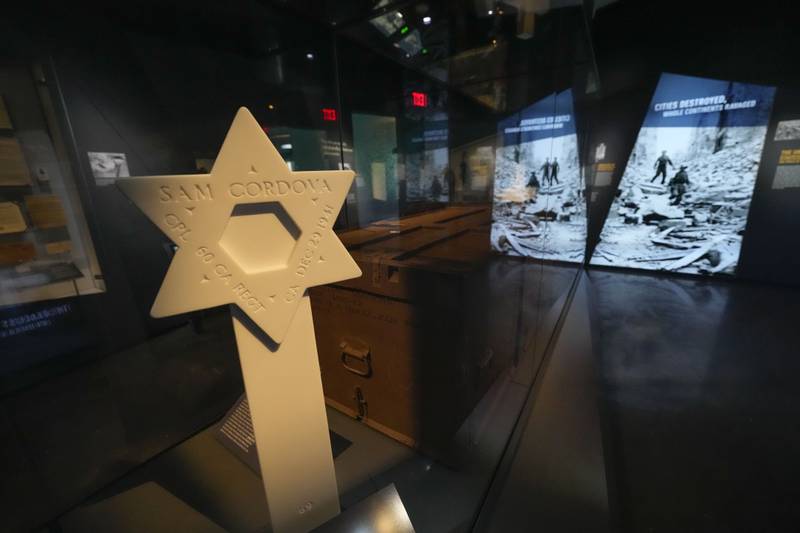 A reproduction of the headstone of Army Corporal Sam Cordova, who was serving with the 60th Coastal Artillery Regiment in the Philippines when he was killed in action on Dec. 29, 1941, is part of the new pavilion of the National World War II Museum, in New Orleans, Tuesday, Oct. 31, 2023.