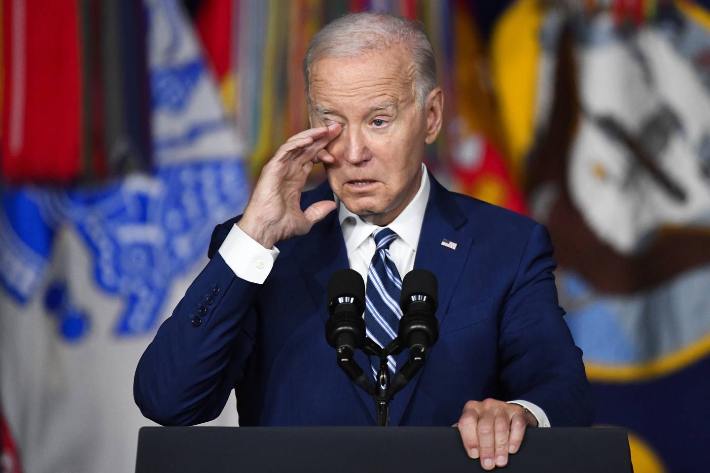 President Joe Biden wipes a tear from his eye while speaking at the George E. Wahlen Department of Veterans Affairs Medical Center, Thursday, Aug. 10, 2023, in Salt Lake City.