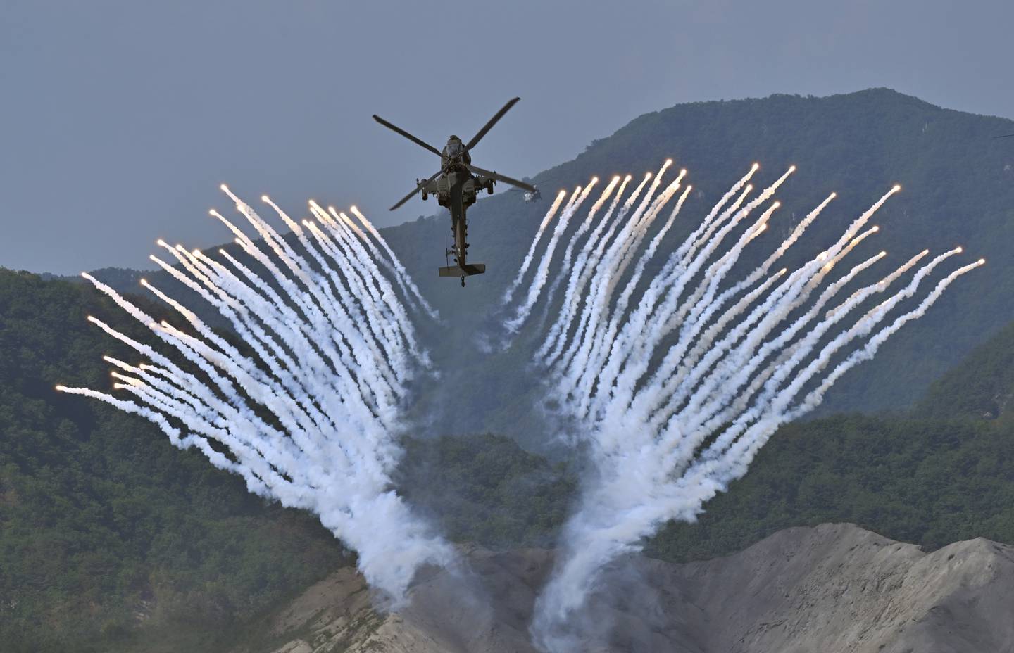 South Korea's Apache AH-64 helicopter fires flares during a South Korea-U.S. joint military drill at Seungjin Fire Training Field in Pocheon, South Korea Thursday, June 15, 2023.