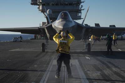 An F-35C Lightning II carrier variant joint strike fighter is prepared for launch  aboard the aircraft carrier USS Nimitz (CVN 68) on Nov. 4, 2014.