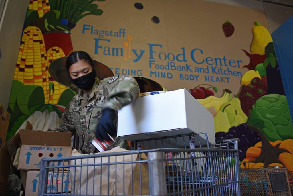 Arizona National Guard personnel deliver boxes of fresh produce and groceries to residents of Coconino County, Ariz., April 7, 2020, at Flagstaff Family Food Center.