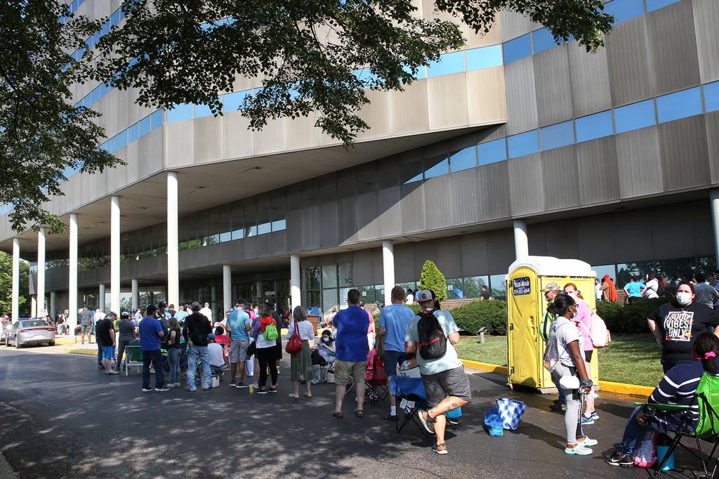 Hundreds of unemployed Kentucky residents wait in long lines outside the Kentucky Career Center for help with their unemployment claims on June 19, 2020 in Frankfort, Ky.