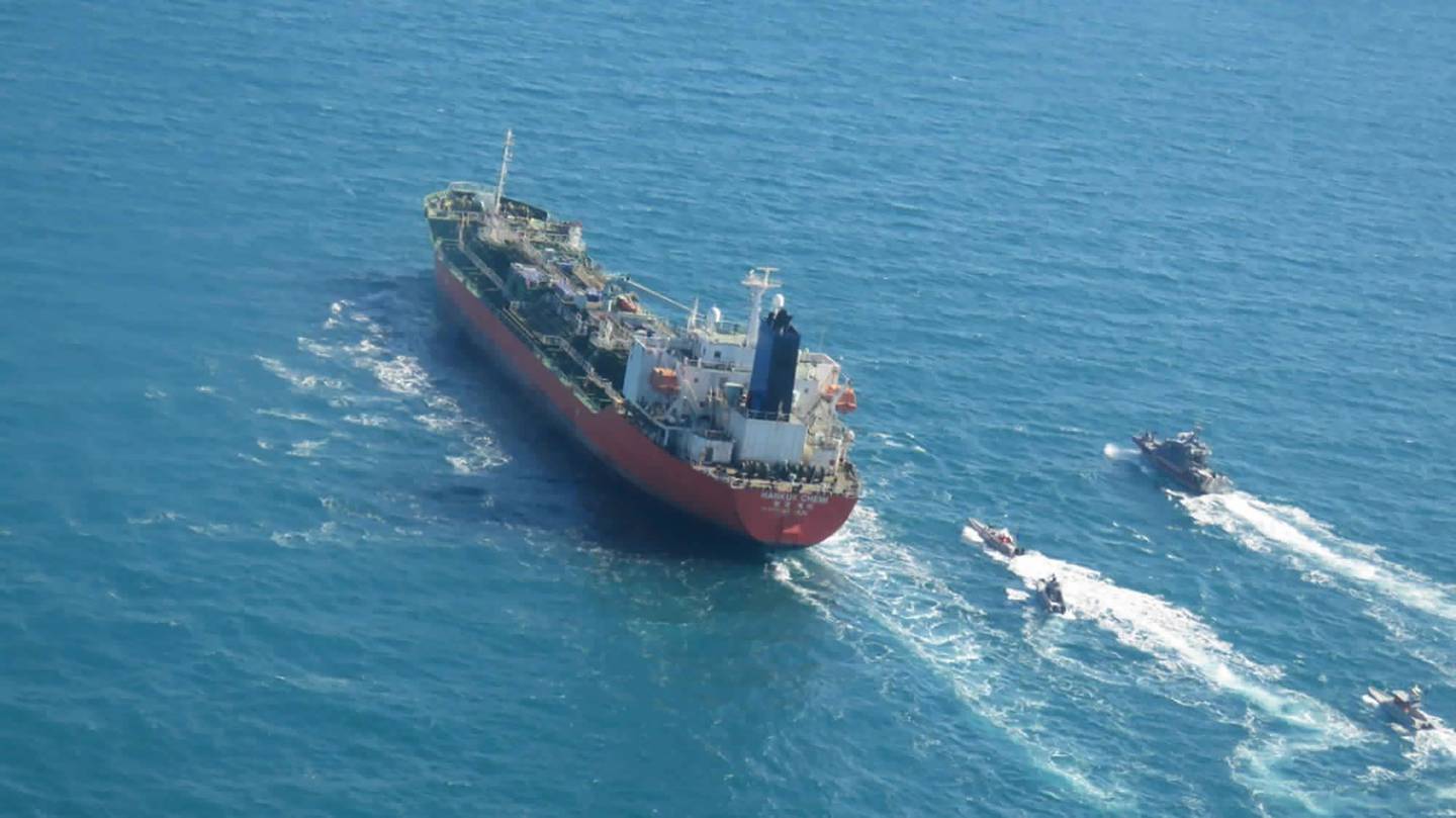 In this photo released Monday, Jan. 4, 2021, by Tasnim News Agency, a seized South Korean-flagged tanker is escorted by Iranian Revolutionary Guard boats on the Persian Gulf.