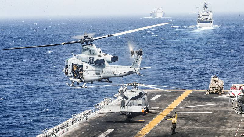 A UH-1Y Venom helicopter  takes off from the flight deck of the amphibious assault ship USS Boxer (LHD 4) on July 18, 2019, during a Strait of Hormuz transit.