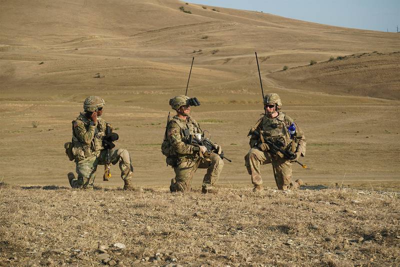Three soldiers prepare to begin a live-fire exercise near Tbilisi, Georgia, Aug. 4, 2019.