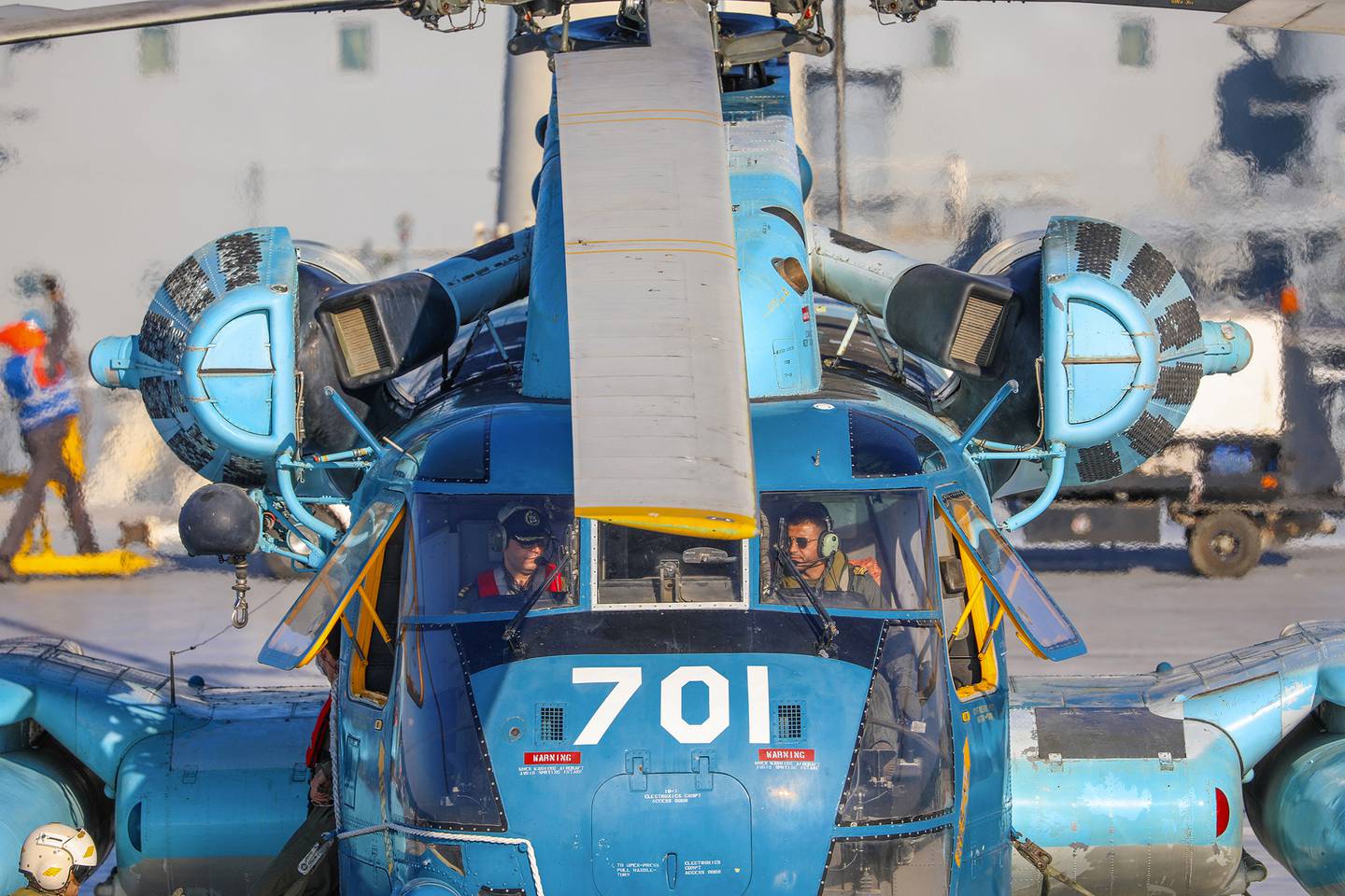 This image released Thursday, Jan. 14, 2021, by the Iranian Army shows a helicopter on an Iranian-made Makran logistics vessel during a naval drill.