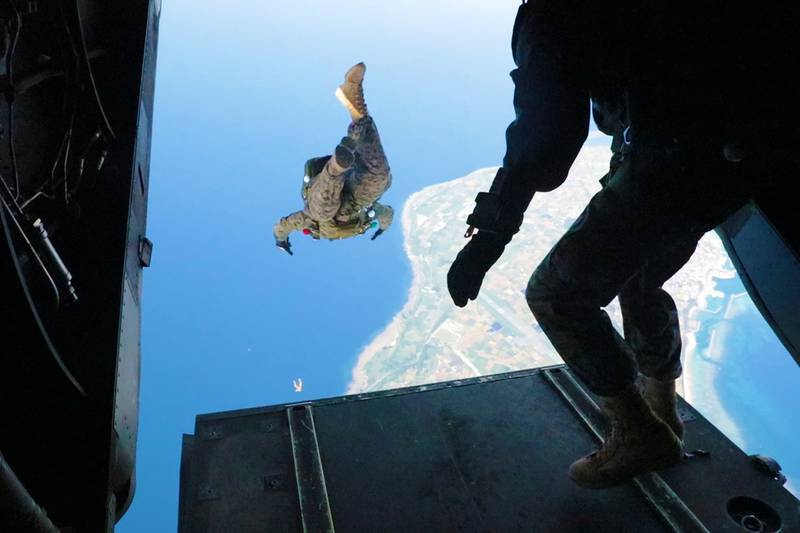 Cpl. Dustin Murphy, left, and Gunnery Sgt. Christopher Bird, right, conduct military free fall operations June 6, 2019, on Ie Shima, Okinawa, Japan.