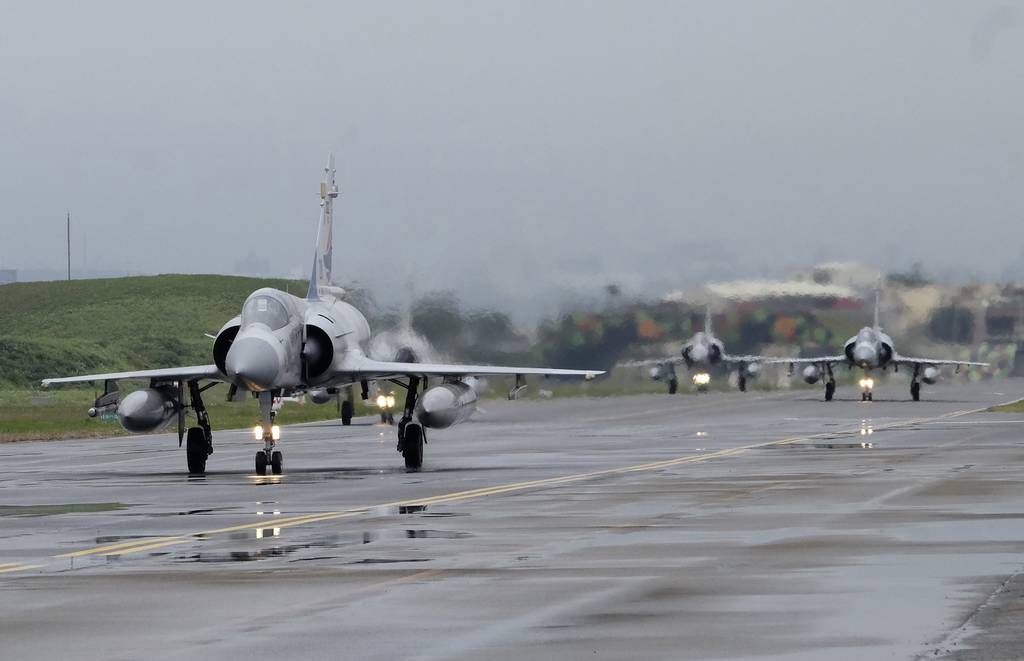 Taiwanese Mirage 2000 fighter jets taxi along a runway during a drill at an airbase in Hsinchu, Taiwan, Wednesday, Jan. 11, 2023.