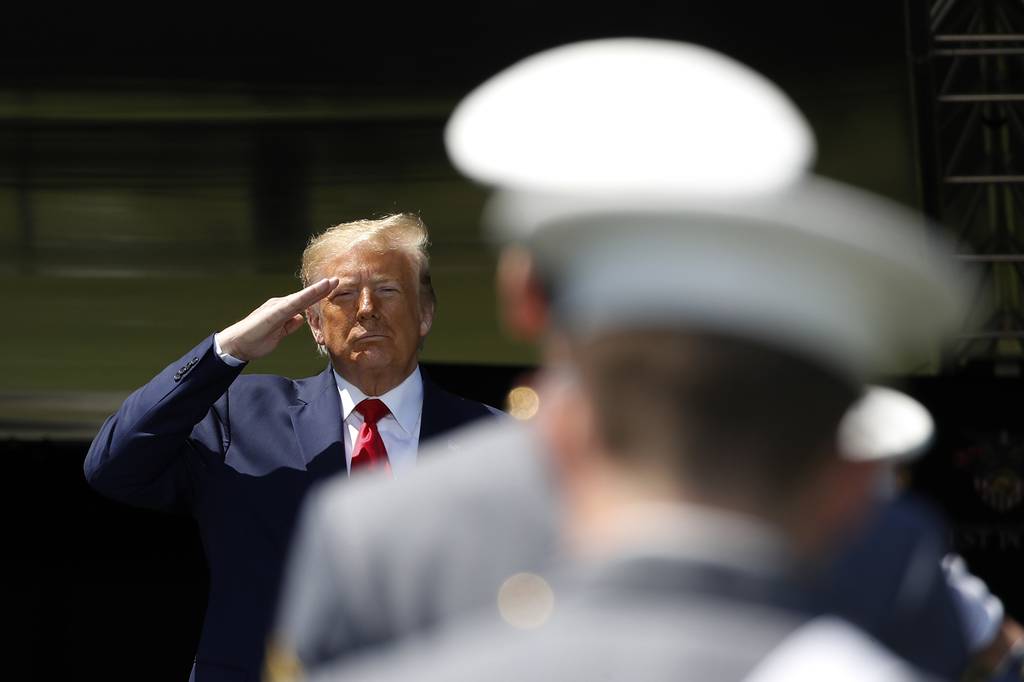 President Donald Trump salutes after speaking to over 1,110 cadets in the Class of 2020 at a commencement ceremony on the parade field, at the United States Military Academy in West Point, N.Y., Saturday, June 13, 2020.