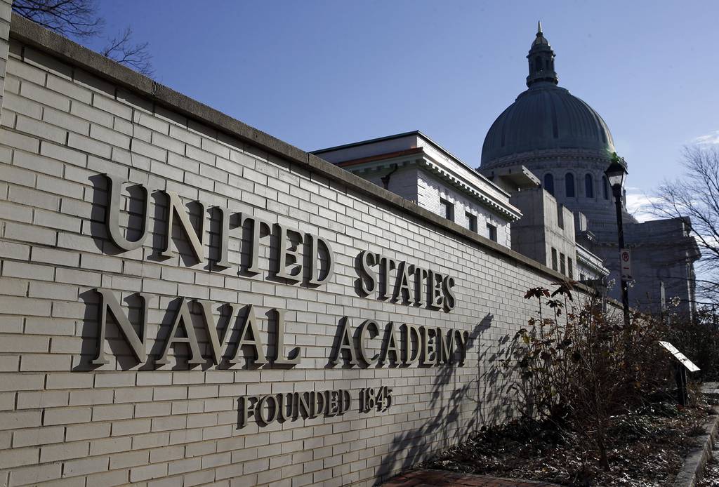 A sign stands outside of an entrance to the U.S. Naval Academy campus in Annapolis, Md., on Jan. 9, 2014.