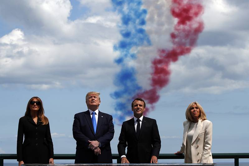 First lady Melania Trump, President Donald Trump, French President Emmanuel Macron and Brigitte Macron, watch a flyover during a ceremony to commemorate the 75th anniversary of D-Day at the American Normandy cemetery