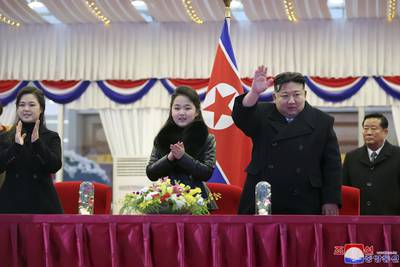 In this photo provided by the North Korean government, North Korean leader Kim Jong Un, second right, with his daughter and his wife Ri Sol Ju, left, attends a performance to celebrate the New Year in Pyongyang, North Korea, Sunday, Dec. 31, 2023.