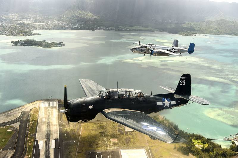 Vintage aircraft fly in formation over Oahu, Hawaii, on Sept. 1, 2020, for the 75th commemoration of the end of WWII.