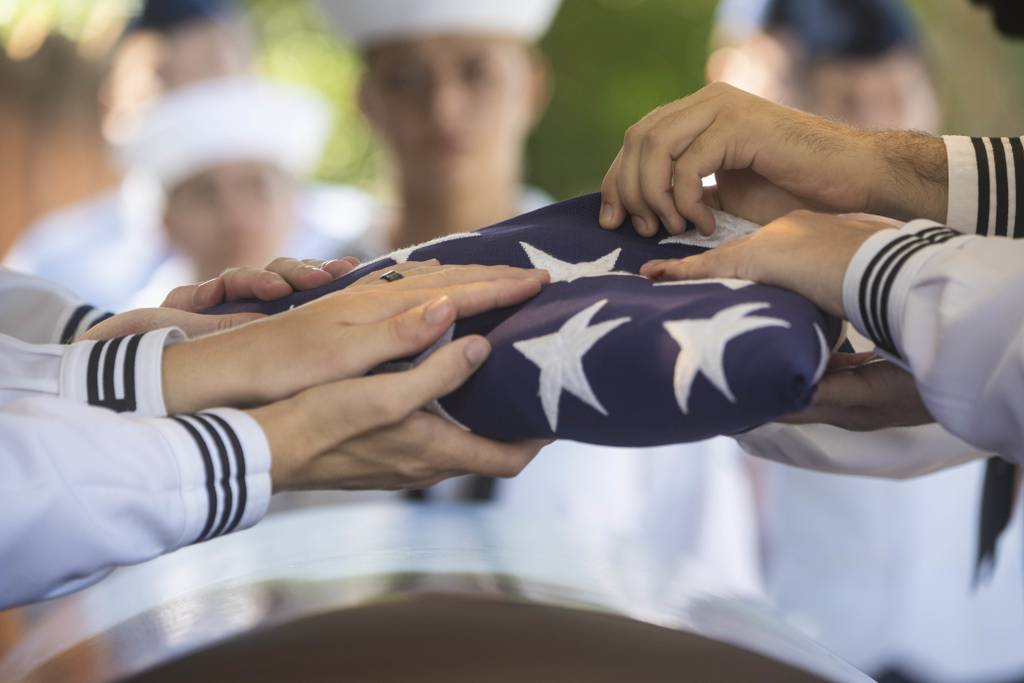 Sailors conduct an interment ceremony held at the National Memorial Cemetery of the Pacific, Honolulu, Sept. 21, 2022.
