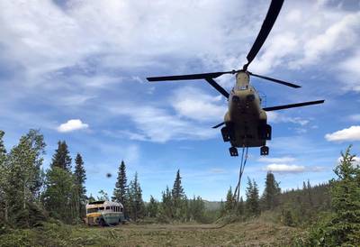 In this photo released by the Alaska National Guard, Alaska Army National Guard soldiers use a CH-47 Chinook helicopter to removed an abandoned bus, popularized by the book and movie "Into the Wild," out of its location in the Alaska backcountry Thursday, June 18, 2020, as part of a training mission.