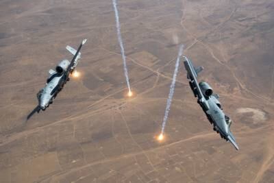 Two U.S. Air Force A-10 Thunderbolt IIs release countermeasure flares over the U.S. Central Command area of responsibility, July 23, 2020.