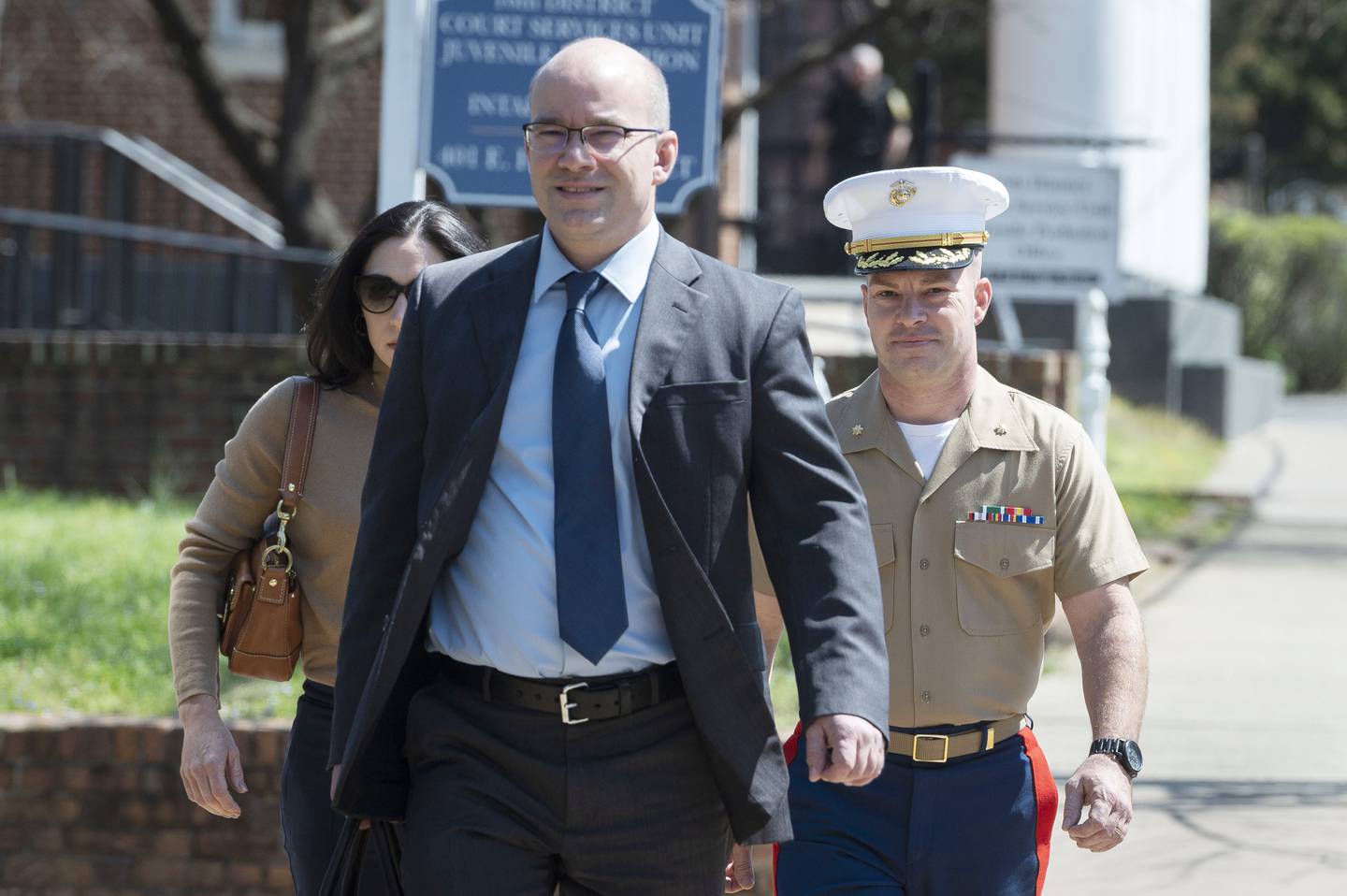 Marine Maj. Joshua Mast and his wife, Stephanie, arrive at Circuit Court, with his attorney and brother, Richard Mast, Thursday, March 30, 2023 in Charlottesville, Va.