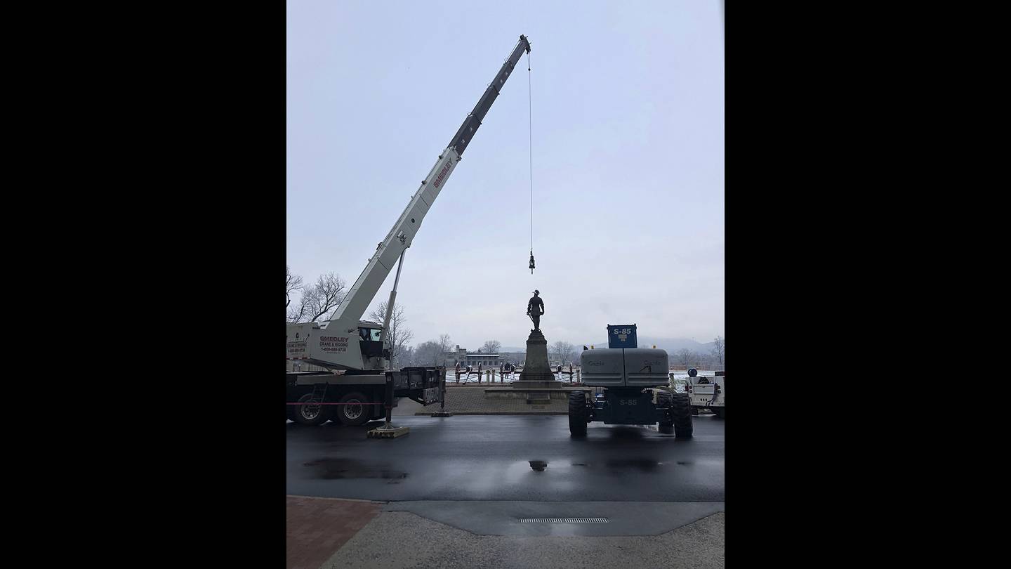 Crews prepare to remove a statue of Confederate Gen. Thomas "Stonewall" Jackson from the campus of the Virginia Military Institute on Monday, Dec. 7, 2020, in Lexington, Va.